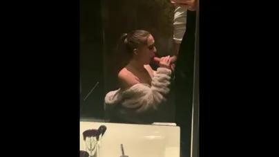 Goregous gal gags on giant cock in grand public bathroom